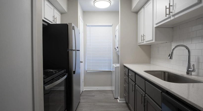 a kitchen with white cabinets