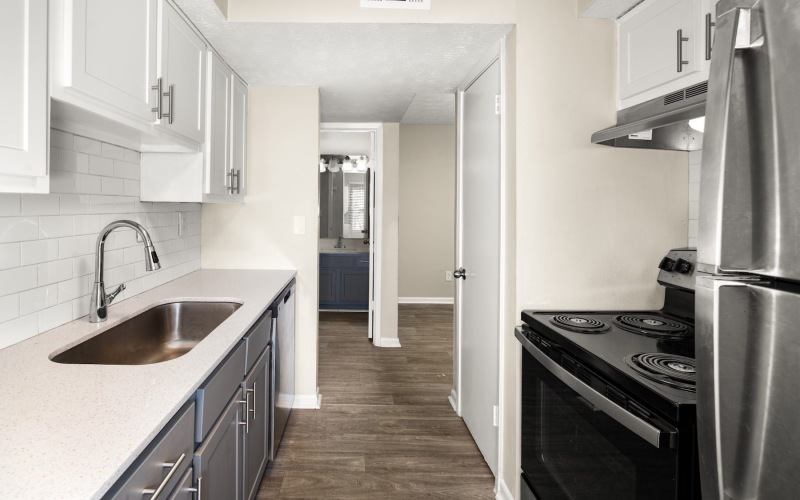 a kitchen with white cabinets